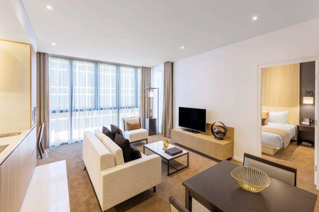 Skye Suites Cité de Sydney Chambre photo A living room at the hotel